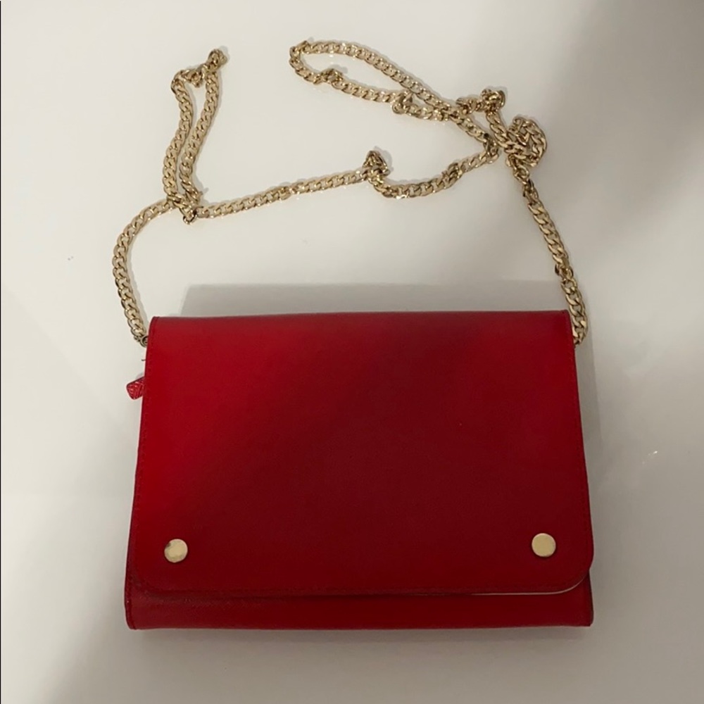 Red wallet on purse with chain